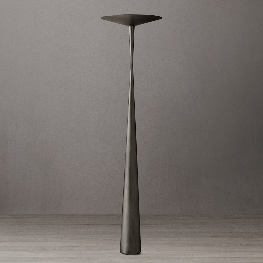 Tall, thin black lamp against a gray background